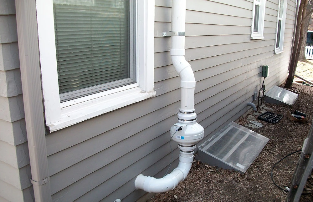 Radon mitigation installation, outside home